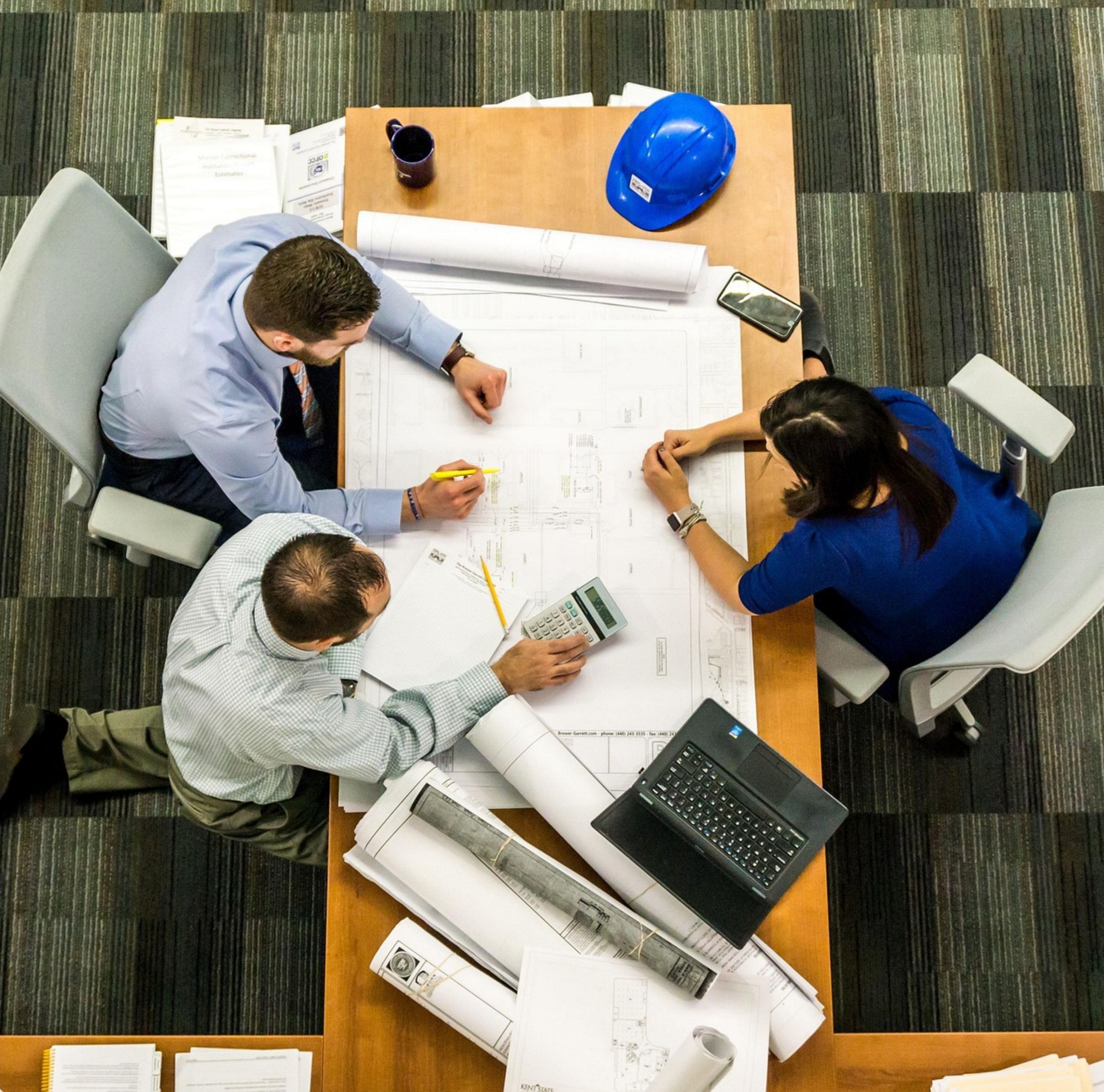 Architects collaborating on design plans 